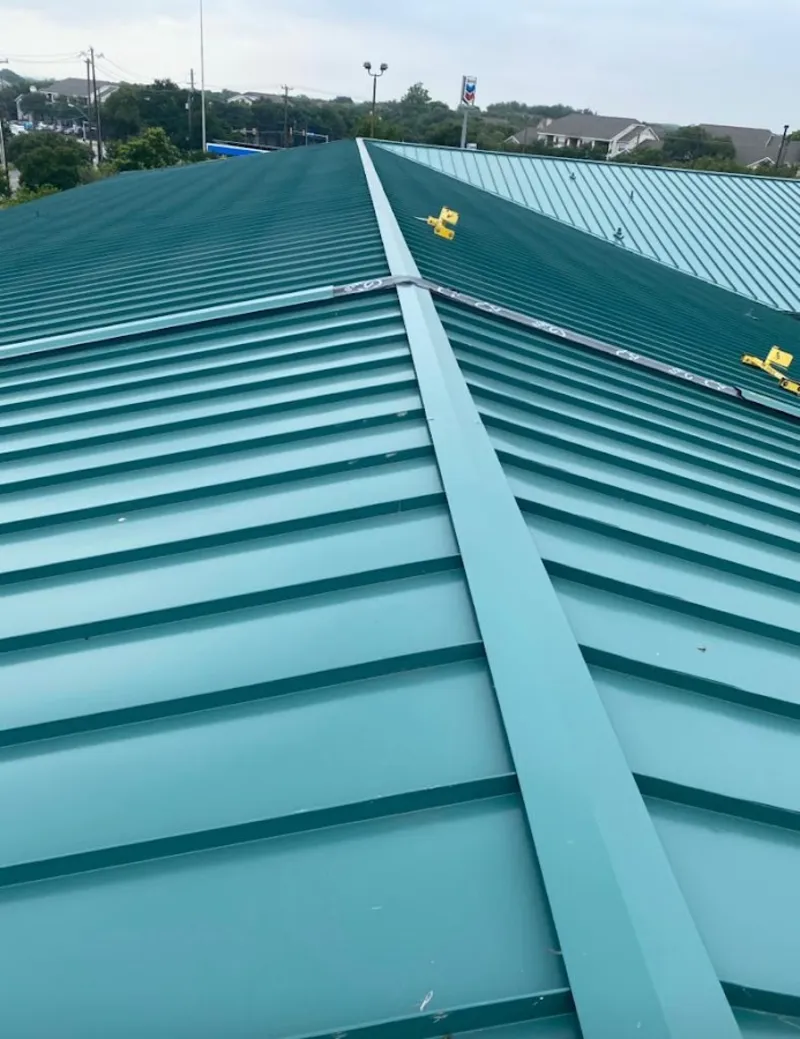 Green commercial metal roof ridge and valley for Metal Roof Repair in Broussard